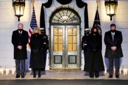 President Joe Biden, First Lady Jill Biden, Vice President Kamala Harris and her husband Doug Emhoff, bow their heads during a ceremony to honor the 500,000 Americans that died from COVID-19, at the White House, Monday, Feb. 22, 2021, in Washington. (AP Photo/Evan Vucci)