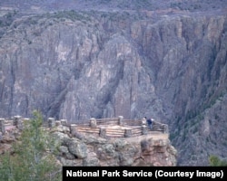 People look out at Gunnison Point