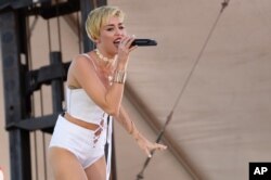 Miley Cyrus performs at IHeartRadio Music Village, Sept. 21, 2013 in Las Vegas.