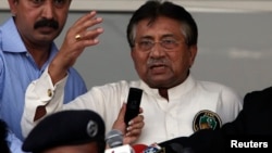 Pakistan's former president, Pervez Musharraf, addresses a group of supporters following his arrival in Karachi March 24, 2013.