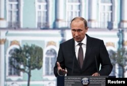 FILE - Russian President Vladimir Putin’s handling of the economic crisis received low marks from 27% of analysts, a recent survey shows.