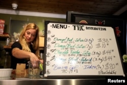 A sign advertises the available cannabis products at the Thomas H. Clarke Distribution retail store as Canada legalizes recreational marijuana, in Portugal Cove-St. Philip's, Newfoundland and Labrador, Canada, Oct. 17, 2018.