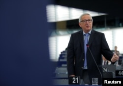 FILE - European Commission President Jean-Claude Juncker delivers a speech during a debate on the future of Europe at the European Parliament in Strasbourg, France, May 30, 2018.
