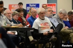 Voters listen to the candidates speak during a forum for Georgia's 6th Congressional District special election in Marietta, Georgia, April 3, 2017.
