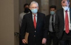 U.S. Senate Majority Leader Mitch McConnell, Republican of Kentucky, walks to his office from the Senate Floor at the U.S. Capitol in Washington, Dec. 18, 2020.