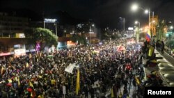 People take part in a protest against sexual assault by the police and the excess use of force against peaceful protests, in Bogota, Colombia, May 15, 2021.