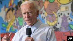 Democratic presidential candidate former Vice President Joe Biden tours the Youth Empowerment Project Bike Works that targets at risk youth and young people in New Orleans, July 23, 2019.