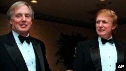 FILE - Robert Trump (L) joins his brother, then real estate developer Donald Trump, at an event in New York, Nov. 3, 1999. A court has ruled that a tell-all book by President Donald Trump's niece now can be distributed despite Robert Trump's objections.