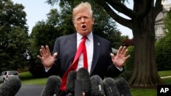 President Donald Trump speaks to the media on the South Lawn of the White House in Washington, May 23, 2018, en route to a day trip to New York. 
