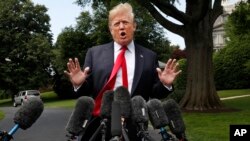 President Donald Trump speaks to the media on the South Lawn of the White House in Washington, May 23, 2018, en route to a day trip to New York. 