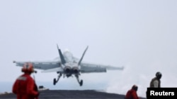 FILE - A F/A-18E Super Hornet fighter jet is catapulted off the flight deck of the USS Dwight D. Eisenhower (CVN 69) aircraft carrier in Southern Red Sea, Middle East, Feb. 13, 2024. 