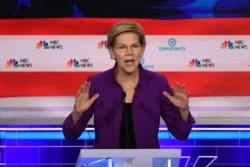 Democratic presidential hopeful Massachusetts Senator Elizabeth Warren participates in the first Democratic primary debate of the 2020 presidential campaign at the Adrienne Arsht Center for the Performing Arts in Miami, June 26, 2019.