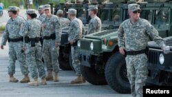 ​​អាជ្ញាធរ​​​នៃ​​​រដ្ឋ​​​ Missouri​ ​​បាន​​​បញ្ជា​​​ឲ្យ​​​ឆ្មាំ​​​ការពារ​​​ជាតិ​​​ឲ្យ​​​ដក​​​ចេញ​​​ពី​​​ទីក្រុងFerguson បន្ទាប់​​​ពី​​​ឆ្មាំ​​​ទាំង​​​នោះ​​​បាន​​​ចូល​​​មក​​​ទី​​​ក្រុង​​​ដើម្បី​​​ជា​​​ជំនួយ​​​ដល់​​​ក្រុម​​​ប៉ូលិស​​​កាល​​​ពី​​​ថ្ងៃ​​​ចន្ទ​​​ទី​​​១៨​​​ខែ​​​សីហា​​​ឆ្នាំ​​​២០១៤​​​។