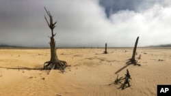 FILE - The Theewaterskloof Dam, a key source of water supply to Cape Town, South Africa, is shown at low levels on April 16, 2017. 