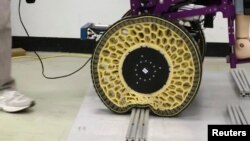 The "morphing" wheel can roll over obstacles up to 1.3 times the height of its radius. Inspired by the surface tension of water droplets, it goes from solid to fluid when it encounters impediments.