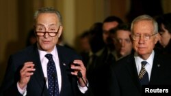 Senate Minority Leader Harry Reid (D-NV) (R) and Senator Chuck Schumer (D-NY) speak with reporters regarding a stop-gap funding bill to avoid a federal government shutdown later this week on Capitol Hill in Washington, Sept. 27, 2016. 