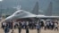 Visitors look at the Chinese military's J-16D electronic warfare airplane during 13th China International Aviation and Aerospace Exhibition, also known as Airshow China 2021, on Wednesday, Sept. 29, 2021, in Zhuhai in southern China's Guangdong province. 
