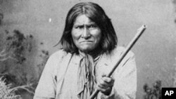 The famed Indian warrior Geronimo, a Chiricahua Apache, posing with a rifle in 1887