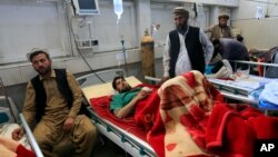 An injured man receives treatment in a hospital, after twin explosions in Jalalabad, Afghanistan, April 6, 2019.