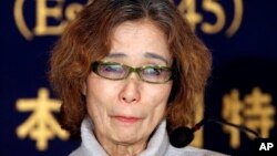 Junko Ishido, mother of Japanese journalist Keni Goto taken hostage by Islamic State, speaks during a press conference in Tokyo, Friday, Jan. 23, 2015.