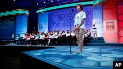 Sky Estrada, 14, of Goodview, Va., reacts after correctly spelling a word in the third round of the Scripps National Spelling Bee, Wednesday, May 29, 2019, in Oxon Hill, Md.