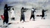 An image from a video dated June 19, 2001, shows members of Al-Qaeda training at their al-Farouq camp in Afghanistan.