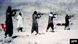 An image from a video dated June 19, 2001, shows members of Al-Qaeda training at their al-Farouq camp in Afghanistan.