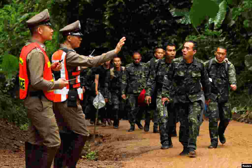 Soldiers arrive outside the Tham Luang cave complex in the northern province of Chiang Rai, July 8, 2018.