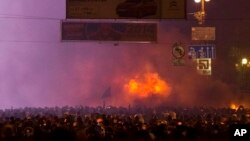 Protesters clash with police in central Kyiv, early Monday, Jan. 20, 2014.