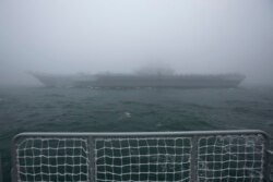 The Chinese People's Liberation Army (PLA) Navy aircraft carrier Liaoning participates in a naval parade to commemorate the 70th anniversary of the founding of China's PLA Navy in the sea near Qingdao in eastern China's Shandong province, Tuesday,…