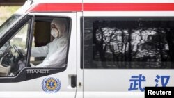 A medical worker drives an ambulance before disinfecting it at Jinyintan hospital in Wuhan, the epicentre of the novel coronavirus outbreak, in Hubei province, China February 14, 2020.