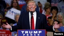 Republican presidential nominee Donald Trump speaks onstage during a campaign rally in Akron, Ohio, U.S., Aug. 22, 2016. 