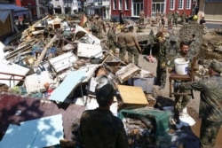 German Bundeswehr soldiers help to clean up the debris following heavy rainfalls, in Bad Muenstereifel, North Rhine-Westphalia state, Germany, July 21, 2021.