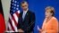 U.S. President Barack Obama listens as German Chancellor Angela Merkel addresses the media during a press conference at the chancellery in Berlin, June 19, 2013.