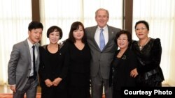 U.S. President Donald Trump reads from his notes as he speaks to reporters on the South Lawn of the White House in Washington before departing for Austin, Texas.