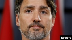 加拿大总理特鲁多1月11日在渥太华举行记者会，要求伊朗承担全部责任。