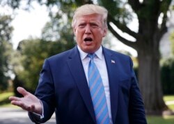 FILE - President Donald Trump speaks to the media before leaving the White House in Washington.