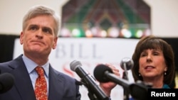 Republican U.S. Representative Bill Cassidy addresses supporters with his wife Laura after winning the runoff election for U.S. Senate against Democrat Mary Landrieu in Baton Rouge, Louisiana, Dec. 6, 2014. 