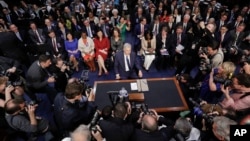 Supreme Court nominee Neil Gorsuch arrives and takes his seat on Capitol Hill in Washington for his confirmation hearing before the Senate Judiciary Committee, March 20, 2017.