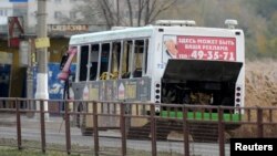 A bus damaged by an explosion is seen on a street in Volgograd October 21, 2013.