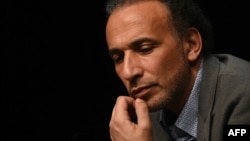 FILE - This file photo taken on March 26, 2016 shows Swiss Islamologist Tariq Ramadan taking part in a conference on the theme "Live together" in Bordeaux.