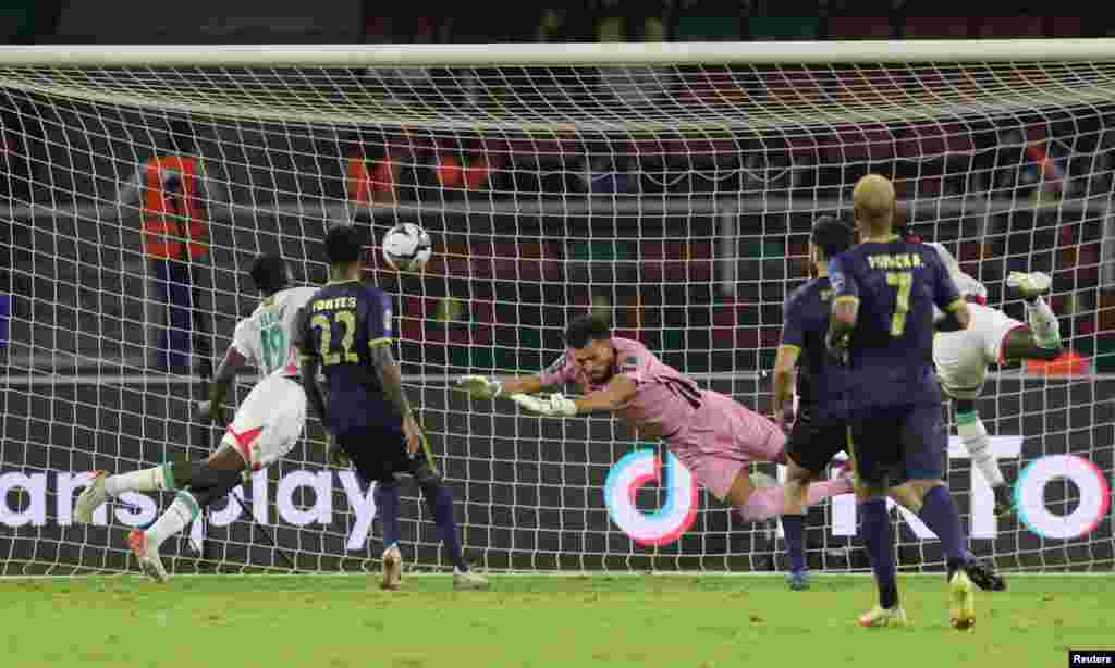 Burkina Faso&#39;s Hassane Bande scores their first goal against Cape Verde.