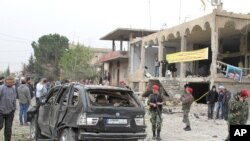 Olina Ortega, left, and Austin Gibbs light candles at a sidewalk memorial in front of Emanuel AME Church where people were killed by a white gunman Wednesday during a prayer meeting inside the historic black church in Charleston, S.C., June 18, 2015. 