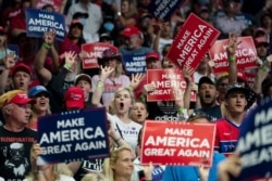 FILE - Supporters of President Donald Trump cheer during a campaign rally at the BOK Center, in Tulsa, Oklahoma, June 20, 2020.