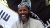 FILE - Mukhtar Robow, then a leader of the Somali militant group al-Shabab, is seen at a news conference at a farm in southern Mogadishu's Afgoye district in Somalia, May 11, 2011. 