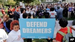 FILE - Immigrant rights supporters gather at the U.S. Capitol in Washington, Sept. 26, 2017. 