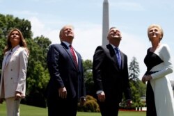 First lady Melania Trump, President Donald Trump, Polish President Andrzej Duda, and his wife Agata Kornhauser-Duda watch a flyover of a F-35 Lightning II jet at the White House, in Washington, June 12, 2019.