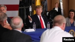 Presiden Donald Trump menghadiri diskusi tentang perdagangan di Duluth, Minnesota, 20 Juni 2018.