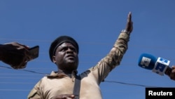 FILE - Former police officer Jimmy "Barbecue" Cherizier, leader of the 'G9' coalition, speaks during a press tour of the La Saline shanty area of Port-au-Prince, Haiti, Nov. 3, 2021.
