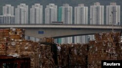 Tons of waste paper to be shipped to mainland China are piled up at a dock in Hong Kong, China, Sept. 15, 2017. 